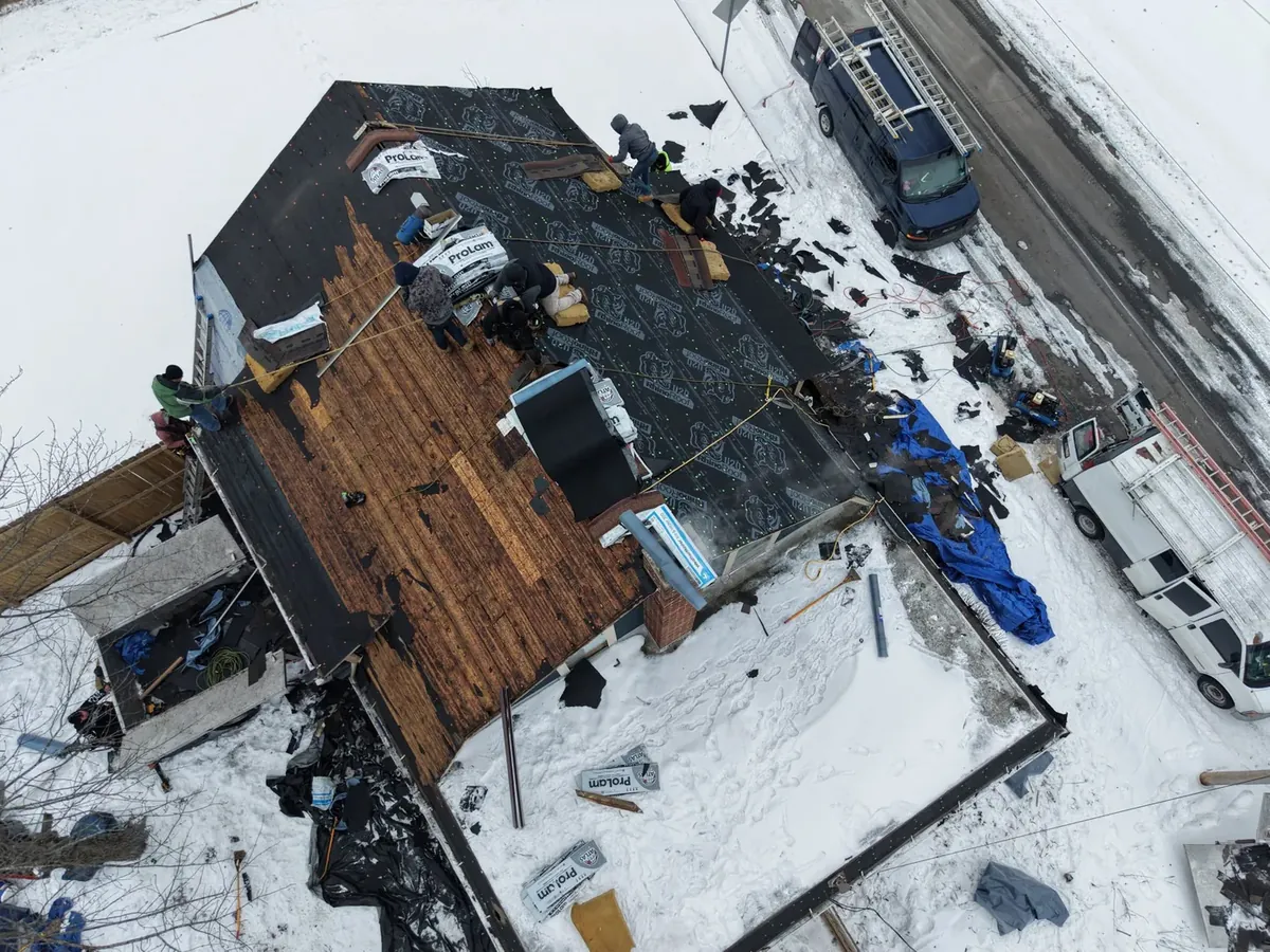 GNG Roofing crew installing a new roof during an Indiana winter