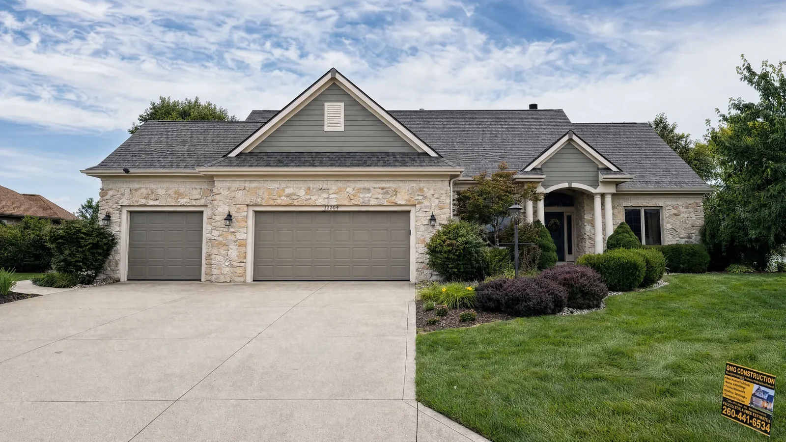 Completed home exterior and roof by GNG Roofing and Construction