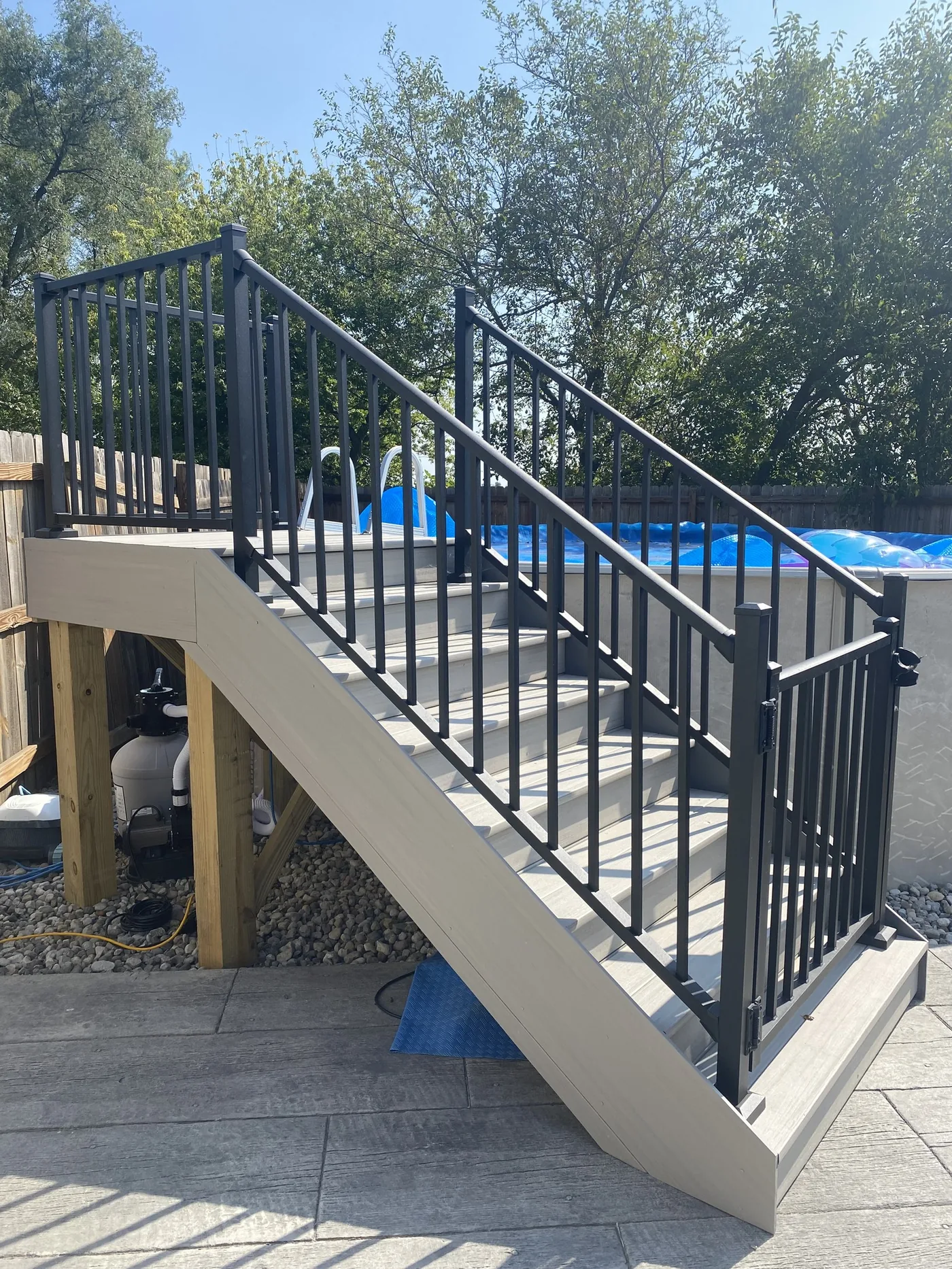 Custom composite deck stairs and aluminum railing built by GNG Construction in Northeast Indiana